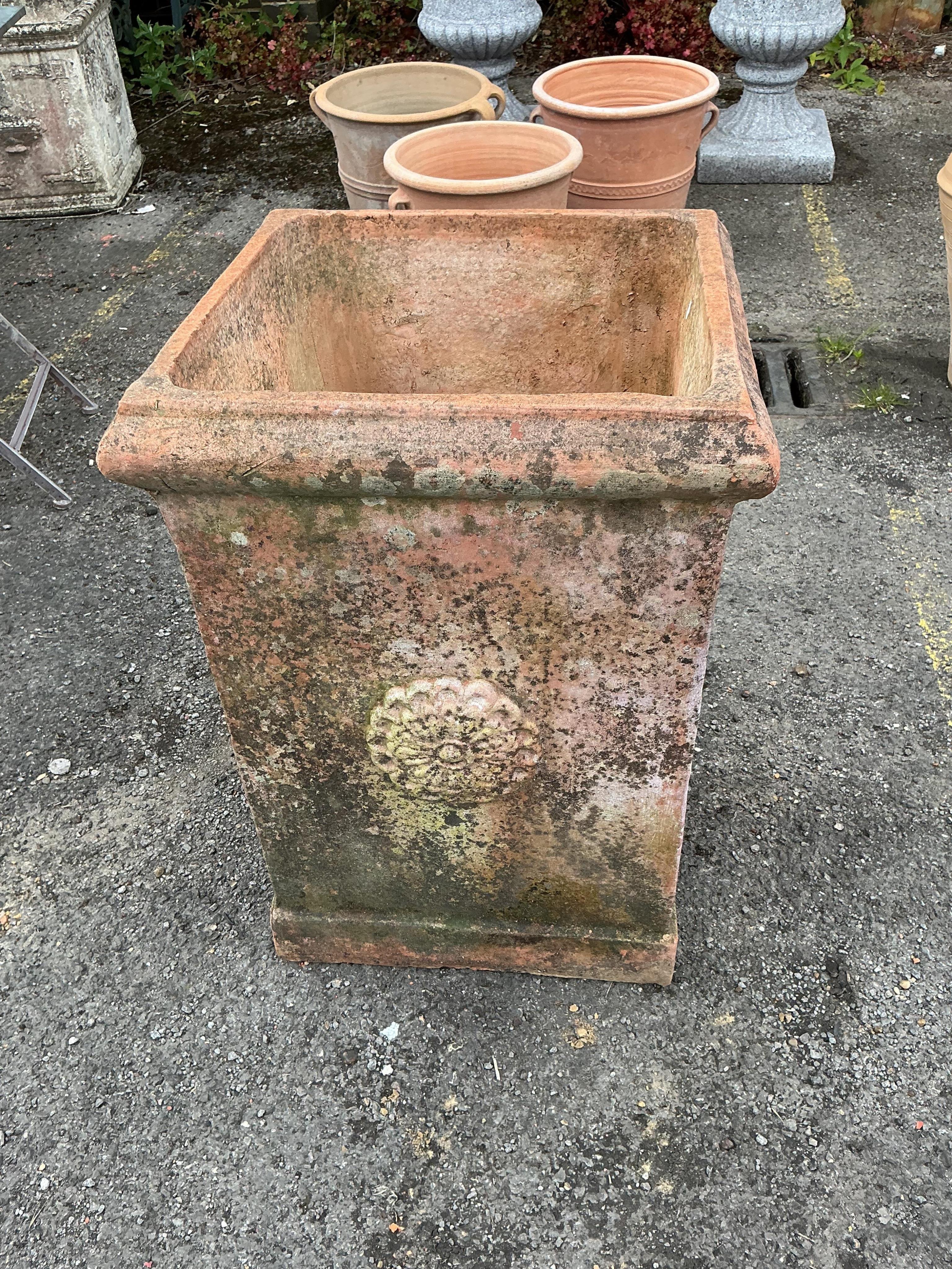 A large square terracotta garden planter, width 46cm, height 64cm